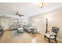 Living room with light beige walls, light wood flooring and comfy seating at 10033 64Th N Ave # 16, St Petersburg, FL 33708