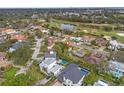 Property location shown with neighborhood context and golf course views at 150 Almedo Ne Way, St Petersburg, FL 33704