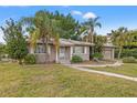 Cute ranch home with a large yard and mature landscaping at 150 Almedo Ne Way, St Petersburg, FL 33704