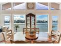 Bright dining room with water views and seating for four at 16134 4Th E St, Redington Beach, FL 33708