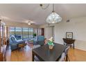 Open dining area with table and chairs, adjacent to living room at 6315 Shoreline Dr # 3202, St Petersburg, FL 33708