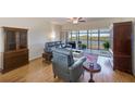Living room features hardwood floors, leather furniture and water views at 6315 Shoreline Dr # 3202, St Petersburg, FL 33708