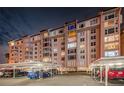 Night view of condo building, showing parking and building lights at 632 Edgewater Dr # 439, Dunedin, FL 34698