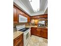 Updated kitchen with granite countertops and wood cabinets at 9860 62Nd N Ter # 1013, St Petersburg, FL 33708