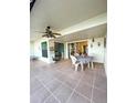 Spacious tiled patio with seating area, perfect for outdoor dining at 9860 62Nd N Ter # 1013, St Petersburg, FL 33708