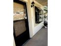 Exterior view of condo entryway with door and window at 11511 113Th St # 13H, Largo, FL 33778