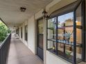 Hallway with a view of condo entrances and a balcony at 11511 113Th St # 13H, Largo, FL 33778