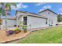 Two-story house with a two-car garage and landscaped yard at 214 Bon Vie Pl, Valrico, FL 33594