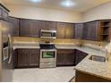 Modern kitchen with granite countertops and stainless steel appliances at 2203 Preservation Dr, Plant City, FL 33566