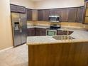 Modern kitchen with granite countertops and stainless steel appliances at 2203 Preservation Dr, Plant City, FL 33566