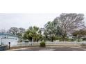Ranch style home with lush landscaping and white picket fence at 2744 45Th S St, Gulfport, FL 33711