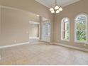 Bright dining room with tile floors and access to other rooms at 32202 Summerglade Dr, Wesley Chapel, FL 33545