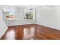 Bright living room with hardwood floors and large windows at 331 Cleveland St # 315, Clearwater, FL 33755