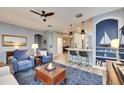 Spacious living room with comfy seating and built-in shelving at 5610 Golden Isles Dr, Apollo Beach, FL 33572