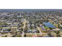 Aerial view showcasing a neighborhood's layout and homes at 6008 49Th N Ave, Kenneth City, FL 33709