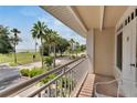 Balcony overlooking a residential street and waterfront at 611 Destiny Dr # 216, Ruskin, FL 33570