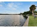Calm waterfront view with a park-like setting and bench at 611 Destiny Dr # 216, Ruskin, FL 33570