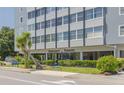 Street-level view of Suncoast Towers, highlighting its entrance and landscaping at 841 4Th Avenue N # 67, St Petersburg, FL 33701