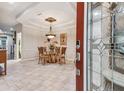 Bright dining room featuring a glass-top table and four chairs at 10002 Bentley Way, Tampa, FL 33626
