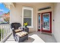 Inviting front porch with wicker chair and potted plants at 10002 Bentley Way, Tampa, FL 33626