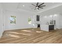 Open concept kitchen with island and stainless steel appliances at 1696 Wilmar Ave, Tarpon Springs, FL 34689
