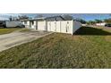 Side view of house with fence and yard at 4617 49Th N Ave, St Petersburg, FL 33714