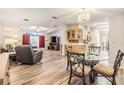 Open living and dining area with hardwood floors at 7800 Kay Marie Ave, Zephyrhills, FL 33541