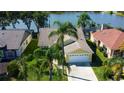 House with lake view and lush green landscape at 11507 Whispering Hollow Dr, Tampa, FL 33635