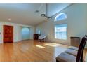 Living room with hardwood floors and a vaulted ceiling at 11507 Whispering Hollow Dr, Tampa, FL 33635