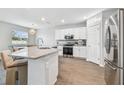 Modern kitchen with stainless steel appliances and granite countertops at 11654 Stone Pine St, Riverview, FL 33569