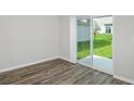 Bright dining room with sliding glass doors leading to the patio at 37306 Sagemoor Dr, Zephyrhills, FL 33541