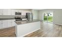 Modern kitchen with stainless steel appliances and an island at 37306 Sagemoor Dr, Zephyrhills, FL 33541