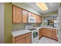 Well-equipped kitchen with light wood cabinets at 5701 Bahia Del Mar Cir # 306, St Petersburg, FL 33715