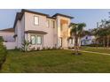 Contemporary two-story house with a metal roof and palm trees at 716 S Lois Ave, Tampa, FL 33609