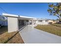 Exterior view of a single story home with carport and landscaped yard at 811 Camellia Ave, Ellenton, FL 34222