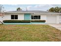House exterior showcasing teal and white color scheme at 956 Bruce Ave, Clearwater Beach, FL 33767