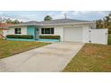 House exterior with teal accents and white siding at 956 Bruce Ave, Clearwater Beach, FL 33767