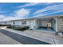 View of the carport and entrance to the home at 12400 Park Blvd # 118, Seminole, FL 33772