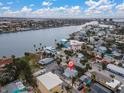 Aerial view of a house by the bay and city at 137 91St Ave, Treasure Island, FL 33706