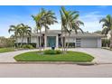 Luxury home with palm trees, circular driveway and garage at 2066 Illinois Ne Ave, St Petersburg, FL 33703
