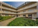 Charming condo building with beautiful balconies and well maintained landscaping surrounding the property at 2221 Swedish Dr # 11, Clearwater, FL 33763