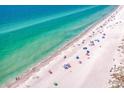 Aerial view of beach with clear water and people at 380 Medallion Blvd # B, Madeira Beach, FL 33708