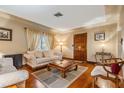 Bright living room featuring hardwood floors and ample natural light at 5927 3Rd N Ave, St Petersburg, FL 33710