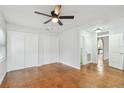 Bedroom with hardwood floors and double door closets at 10308 Forest Hills Dr, Tampa, FL 33612