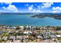 Home situated in a neighborhood near the water with bridges visible at 1145 Boca Ciega Isle Dr, St Pete Beach, FL 33706