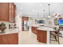Gourmet kitchen featuring granite countertops and large island at 11807 Summer Springs Dr, Riverview, FL 33579