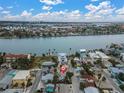 Aerial view showcasing a house's location in a coastal neighborhood at 130 90Th Ave, Treasure Island, FL 33706