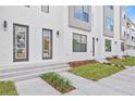 Front view of townhouses with modern design and landscaping at 2506 W Cleveland St # 18, Tampa, FL 33609