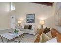 Bright living room featuring a neutral color palette and stylish furnishings at 2736 Haverhill Ct # 2736, Clearwater, FL 33761