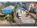 Aerial view of a waterfront home with RV parking and solar panels at 316 16Th Ave, Indian Rocks Beach, FL 33785